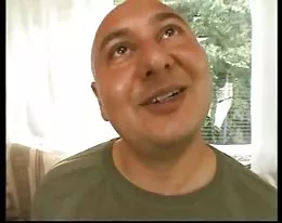 a German mature couple with their campervan