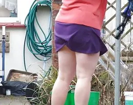 wife hanging washing - pantieless