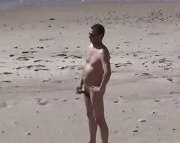 A Voyeur films a couple on beach