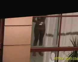 Let&#039;s looking once again through the window as a naked girl