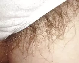 pubic hairs sticking out of the sides of her white pantys,