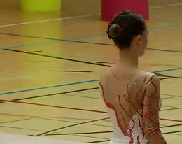 Brunette Gymnast Displays Her Shaven Pussy