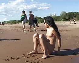 Lovely teen bare their bodies at a nudist beach