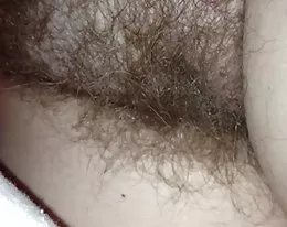 close up of my girls hairy pussy under the sheets.