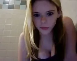 College grad in washroom and library showing self